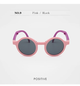 Pink and purple foldable kids sunglasses with round matte frames and UV protection lenses