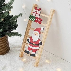 Christmas wooden ladder decoration with Santa Claus and gift box on snowy background
