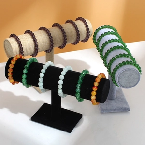 Detailed view of velvet bracelet display stands showcasing various gemstone beaded bracelets