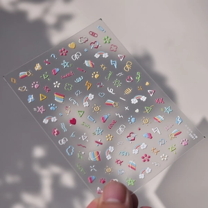 5D embossed nail stickers featuring colorful rainbow, clouds, and cute hand-drawn graffiti art