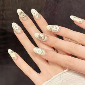 Handmade press-on nails with white camellia flowers and champagne gold glitter