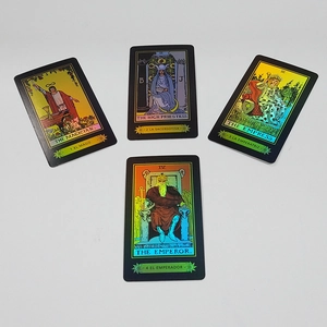 Close-up of laser metallic tarot cards featuring The Magician and High Priestess designs