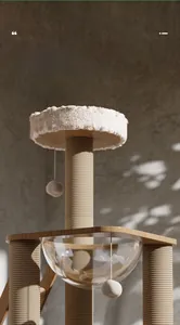 Detail of the clear acrylic space capsule and sisal scratching post on a large wooden cat tree