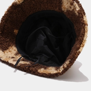 Detail of the inner black lining and adjustable drawstring of this plush bucket hat