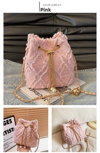 Detail of pink denim bucket bag with quilted fringe texture and pearl drawstring