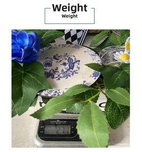 Blue and white porcelain plate with floral patterns weighed at 271g on digital scale