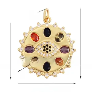 Detail of vintage 18K gold plated eye pendant with colored gemstones and dimensions