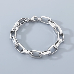Detailed close-up of a silver stainless steel chunky paperclip chain bracelet in high quality