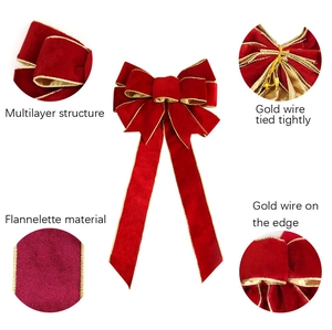 Detail of red multilayer velvet Christmas bow with gold wire edges and sturdy binding