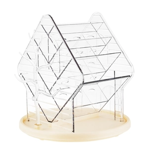 Rotating house-shaped makeup organizer with clear tiers and side jewelry branch hangers