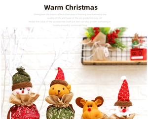 Detail of four Christmas drawstring gift bags with cartoon Santa, snowman, elk and bear designs