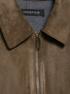 Close-up of the dark brown faux suede jacket collar and metal zipper detail