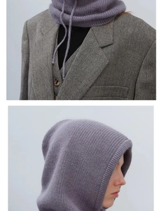 Detail view of purple knitted balaclava with drawstring showing texture and chic style