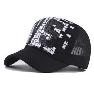 Black trucker hat featuring 3D puzzle pattern print and breathable mesh back panel