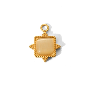 Macro detail of a gold square pendant featuring a beige cat eye stone and beaded edges
