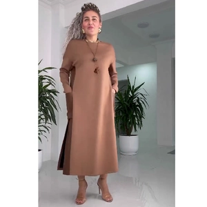 Brown long-sleeved straight dress with side slits and contrast leather patchwork detail