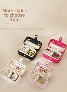 Flat lay of mini travel jewelry boxes in four colors with ring slots and soft lining