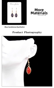 Detailed view of marquise cut blue sand stone and red gem alloy drop earrings on model