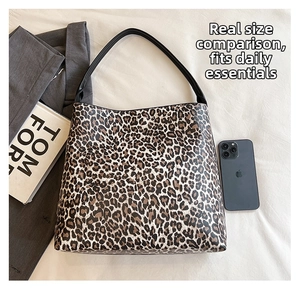 Detailed top view of leopard print tote bag size comparison with a smartphone
