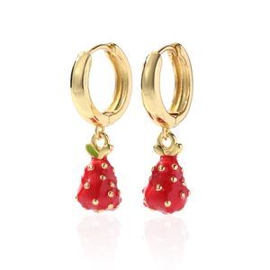Close-up of cute red strawberry earrings with golden hoops and vibrant enamel finish