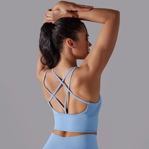 Detail view of light blue criss-cross back sports bra with ribbed seamless texture