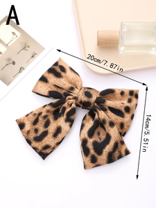 Leopard print bow hair clip detail with 20cm by 14cm dimensions in a stylish layout