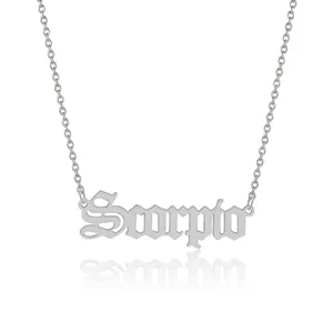 Close-up of silver Gothic Scorpio letter pendant on a stainless steel link chain