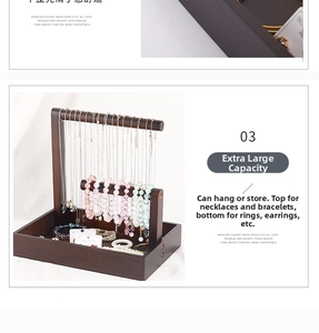 Detailed view of dark wood jewelry stand with hanging hooks and tiered tray storage