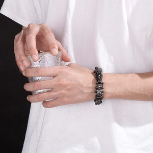 Macro detail of men's gothic leopard skull bracelet in vintage stainless steel finish