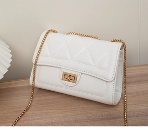 Close-up of white quilted PU leather bag with gold chain strap and square metal lock