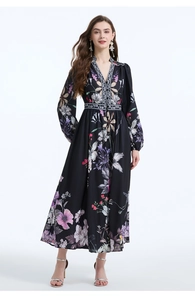 Detail of V-neck long sleeve floral maxi dress with vibrant flower print and elastic cuffs