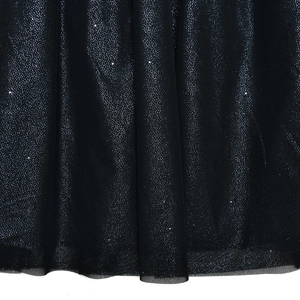 Macro detail of black mesh fabric with sparkling glitter texture for party dresses