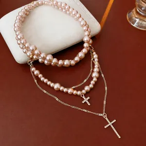 Double-layer champagne pearl necklace with sparkling rhinestone cross pendant