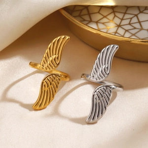 Adjustable wing rings in gold and silver steel finishes with feather texture detail