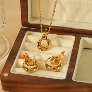 Minimalist 18k gold stainless steel necklace and earrings set in a wooden jewelry box