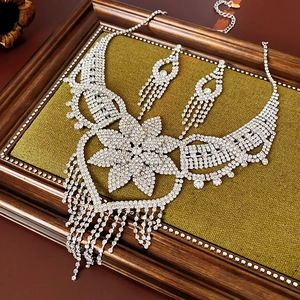 Exquisite silver floral necklace and tassel earrings set with sparkling rhinestones