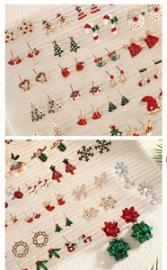 Detailed view of Christmas stud earring set with rhinestones and colorful enamel icons