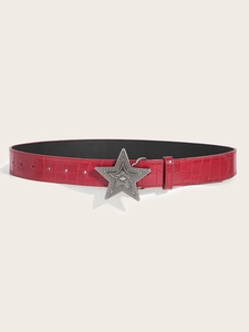 Detail of red crocodile texture leather belt featuring a vintage silver star-shaped buckle