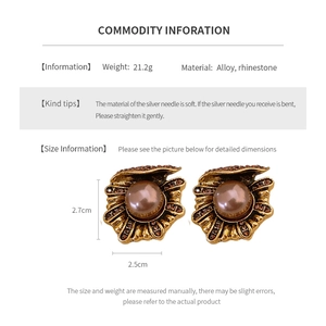 Detailed view of vintage shell earrings with size dimensions and material weight specifications