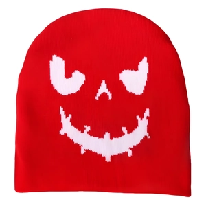 Unisex red knit beanie with white Halloween pumpkin smile face pattern in high detail