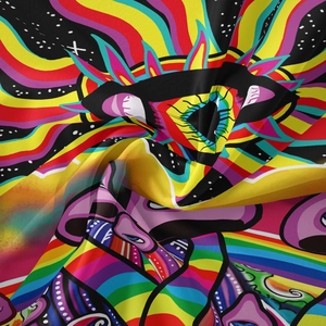 Close-up of vibrant tarot tapestry fabric showing colorful eye patterns and soft silk texture