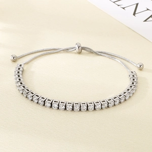Detail of adjustable silver tennis bracelet featuring sparkling round-cut cubic zirconia stones