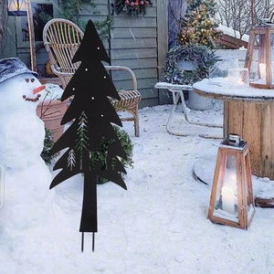 Black metal Christmas tree garden stake featuring reindeer and forest silhouette cutout
