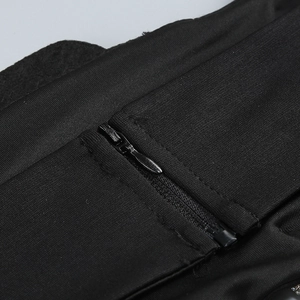 Macro view of a smooth invisible zipper integrated into black textured fabric detail