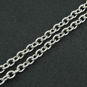 Macro shot of silver stainless steel cross chain link with polished metallic luster