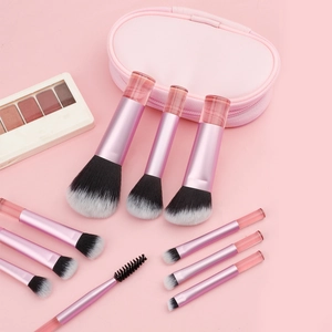 Close-up of 10-piece lavender makeup brush set with a pink textured zipper pouch