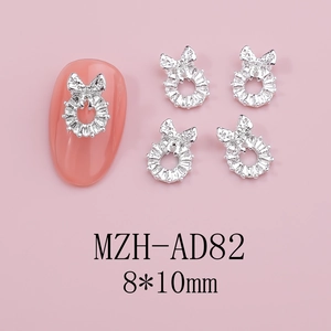 Detail of 8x10mm silver butterfly bow nail charms with sparkling diamond texture
