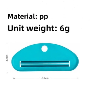 Blue manual toothpaste squeezer made of PP plastic material with dimensions 8.7x3.7cm