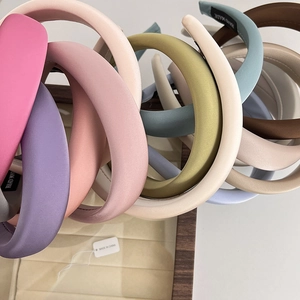 Padded sponge headbands for women in assorted spring colors like green, pink, and blue