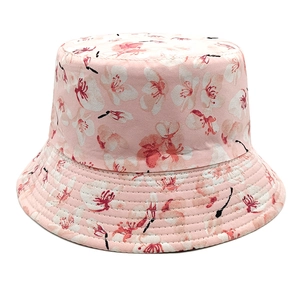 Detail of pink floral bucket hat with white flower print and reinforced brim stitching